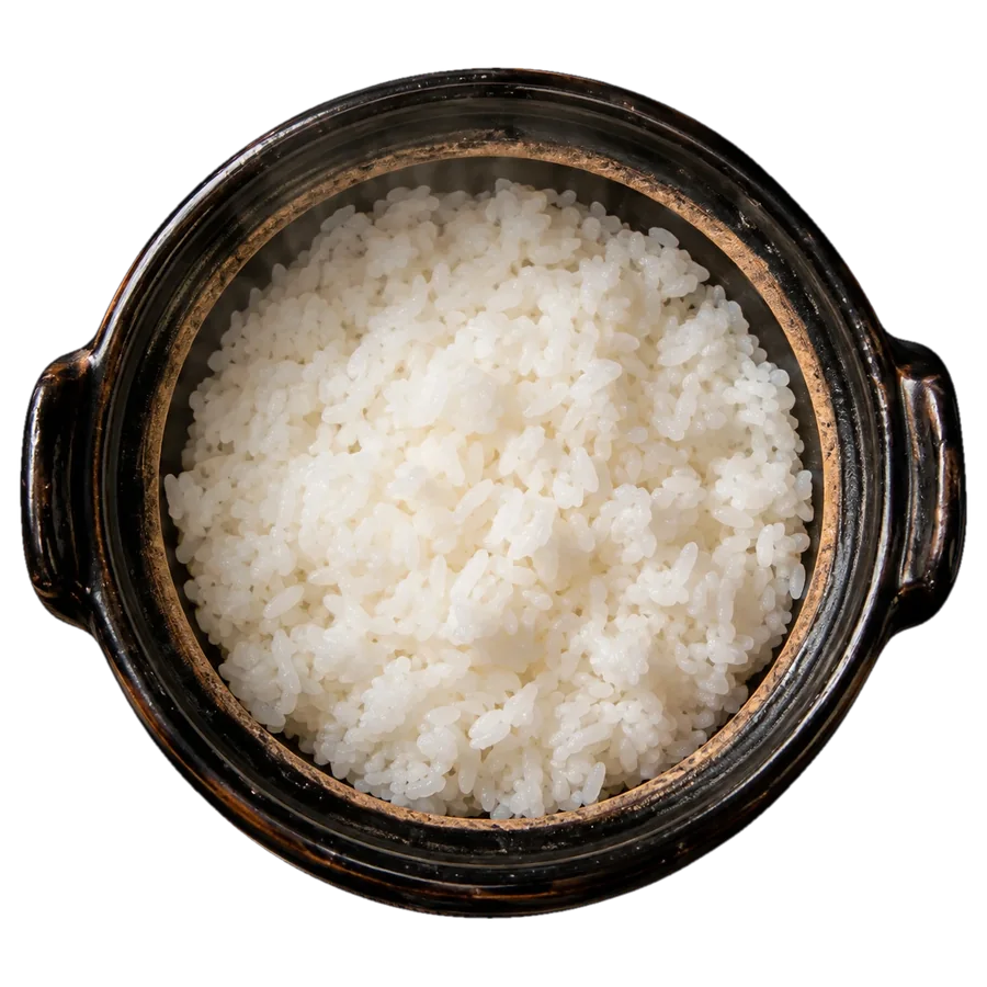 Steaming white rice in a dark glazed clay donabe